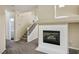 Living room with fireplace and staircase at 221 Gemstone Hill Ave, North Las Vegas, NV 89031