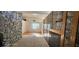 Bedroom with wood-look flooring and stone accent wall at 2504 Llewellyn Dr, Las Vegas, NV 89102