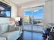 Relaxing living room featuring a sofa, piano, and breathtaking views at 322 Karen Ave # 1207, Las Vegas, NV 89109