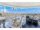 Open living room with city views, seating area, and dining area at 322 Karen Ave # 1207, Las Vegas, NV 89109