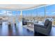 Spacious living room features dark hardwood floors, city views, and comfy seating at 322 Karen Ave # 1207, Las Vegas, NV 89109