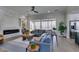 Living room with sectional sofa and modern fireplace at 3315 Garden Shower Pl, Las Vegas, NV 89135