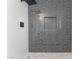 Walk-in shower with gray tile and a built-in niche at 4620 Cinderella Ln, Las Vegas, NV 89102