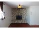 Stone fireplace in living room with hardwood floor at 4709 W Alpine Pl, Las Vegas, NV 89107