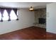 Living room features wood floors and a stone fireplace at 4709 W Alpine Pl, Las Vegas, NV 89107