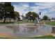 Circular splash pad with various spray features at 4709 W Alpine Pl, Las Vegas, NV 89107