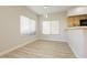 Bright dining area with light wood flooring and large windows at 4810 Grey Wolf Ln # 104, Las Vegas, NV 89149