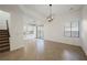 Open dining room with tile floors and kitchen views at 5420 Tinker Toy Ave, Las Vegas, NV 89139