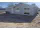 Rear view of a single story home with a large backyard at 5450 Black Rock Way, Las Vegas, NV 89110