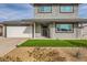 Front view of two-story house with landscaped yard and garage at 7312 Aragon St, Las Vegas, NV 89145