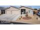 Single-story home with attached two-car garage and landscaped front yard at 841 Santa Theresa Way, Mesquite, NV 89027