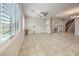 Bright living room with tile floors, plantation shutters and ceiling fan at 90 Einstein Ridge Way, Las Vegas, NV 89183