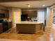 Kitchen with island, stainless steel appliances, and wood flooring at , North Las Vegas, NV 89081