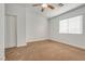 Well-lit bedroom featuring ceiling fan and closet at 1016 Chestnut Bay Ave, North Las Vegas, NV 89031