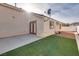 Small backyard patio with artificial grass at 1016 Chestnut Bay Ave, North Las Vegas, NV 89031