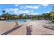 Community pool with lounge chairs and shade structures at 1149 Casetto Ct, Henderson, NV 89052