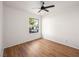 Well-lit bedroom with wood floors and window view at 1265 Del Lilly Ln, Las Vegas, NV 89123