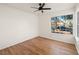 Bedroom with large window and wood flooring at 1265 Del Lilly Ln, Las Vegas, NV 89123