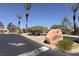 Community entrance with stone sign and palm trees at 1607 Coal Valley Dr, Henderson, NV 89014