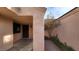 Covered entryway with a dark brown door and small courtyard at 1940 Whiton St, Las Vegas, NV 89156