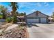 Single-story home with two-car garage, landscaped yard, and solar panels at 3170 Shadow Bluff Ave, Las Vegas, NV 89120