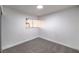 Simple bedroom with grey carpet and window with mini blinds at 3240 Medicine Man Way, Las Vegas, NV 89169