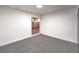 Bedroom with grey carpet, window with backyard view, and bright walls at 3240 Medicine Man Way, Las Vegas, NV 89169