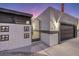 Dark-colored garage door and decorative gate at 3240 Medicine Man Way, Las Vegas, NV 89169