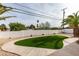 Artificial turf and rock landscaping in backyard at 341 Bedford Rd, Las Vegas, NV 89107