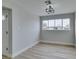 Spacious dining area with wood-look flooring and large window at 341 Bedford Rd, Las Vegas, NV 89107