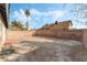 Large backyard with dirt and small patio area at 3932 Lancome, Las Vegas, NV 89115