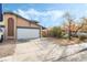 House exterior featuring a white garage door and a small front yard at 3932 Lancome, Las Vegas, NV 89115