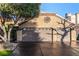 Two-car garage, desert landscaping, and a clean stucco exterior at 4104 Browndeer Cir, Las Vegas, NV 89129