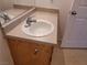 Bathroom vanity with single sink and wood cabinet at 4730 E Craig Rd # 1134, Las Vegas, NV 89115