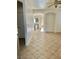 Living room with tiled floors and an archway leading to the kitchen at 5455 Hasley Canyon Ave, Las Vegas, NV 89139