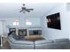 Living room with gray sectional sofa and stone fireplace at 6401 Home Run Dr, Las Vegas, NV 89130