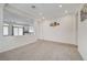 Open living room featuring a half wall and view into kitchen at 642 Steep Canyon Ave, Las Vegas, NV 89183