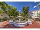 Landscaped courtyard with a central fountain, providing a tranquil atmosphere at 8452 Boseck Dr # 186, Las Vegas, NV 89145