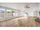 Sunlit living room featuring hardwood floors and large windows at 9031 Aldershot Ct, Las Vegas, NV 89147