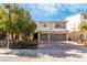 Two-story house with a three-car garage and landscaped front yard at 9637 Lions Peak Ct, Las Vegas, NV 89139