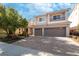 Two-story house with a three-car garage and landscaped front yard at 9637 Lions Peak Ct, Las Vegas, NV 89139