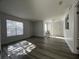 Spacious living room featuring wood-look floors and sliding door access at , Las Vegas, NV 89156