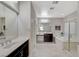 Bathroom with double vanity, soaking tub, and a large walk-in shower at 10218 Rockridge Peak Ave, Las Vegas, NV 89166