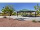 Outdoor covered picnic area with tables at 10218 Rockridge Peak Ave, Las Vegas, NV 89166