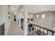 Upstairs hallway with high ceilings and views to the living room below at 10218 Rockridge Peak Ave, Las Vegas, NV 89166