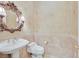 Elegant powder room with ornate mirror and tile at 10925 Iris Canyon Ln, Las Vegas, NV 89135