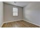 Bright bedroom with hardwood floors and neutral walls at 11078 Neets Bay St, Las Vegas, NV 89179