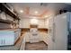 Galley kitchen with white cabinets and granite countertops at 1701 E Katie Ave # 72, Las Vegas, NV 89119