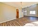 Bright dining area with hardwood floors and access to kitchen at 1803 Tremolite Ave, Las Vegas, NV 89123