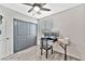 Bright bedroom with a built-in desk and gray closet doors at 1975 Via Primero St, Las Vegas, NV 89115